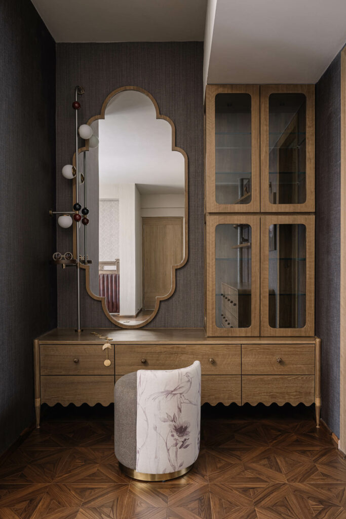 a curved mirror centers a vanity